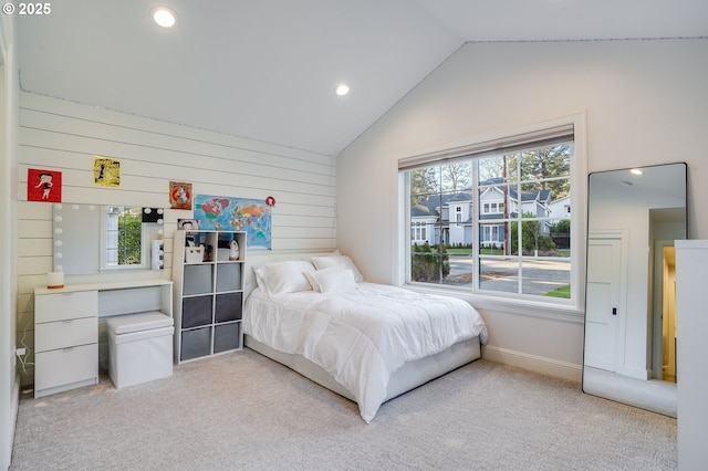 carpeted bedroom featuring lofted ceiling