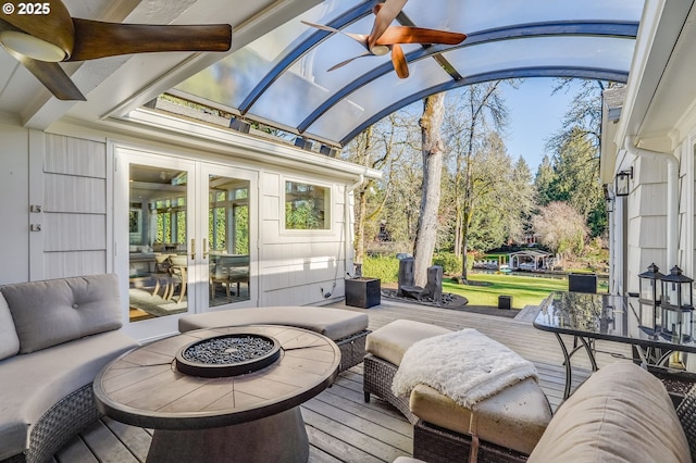 sunroom / solarium with vaulted ceiling with beams and french doors