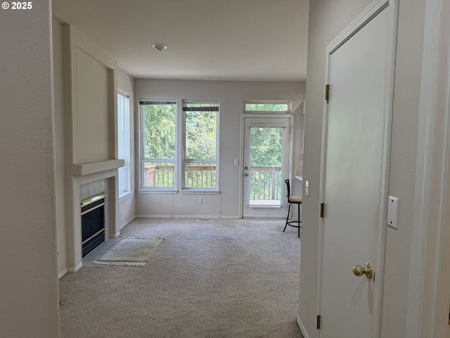 15680 SW Talus Way, Beaverton, OR 97007 - carpeted living area featuring a fireplace and baseboards