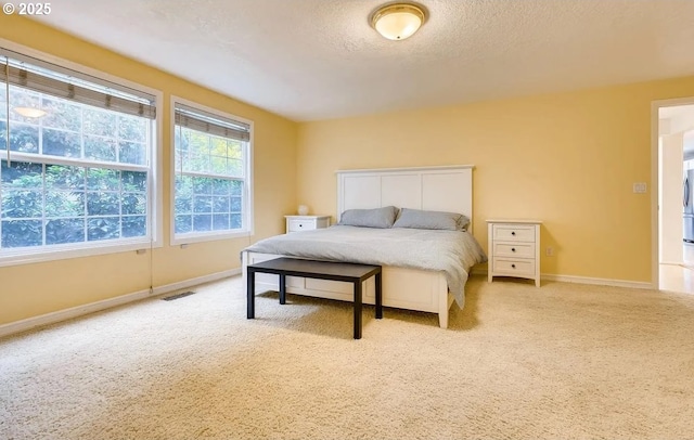 5706 SW Hamilton St, Portland, OR 97221 - carpeted bedroom with baseboards and a textured ceiling