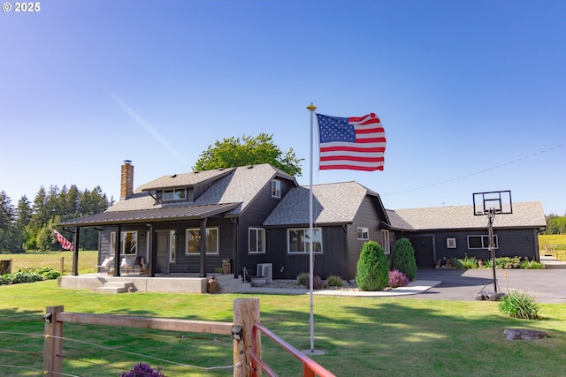 8408 NE 339th St, La Center, WA 98629 - back of house featuring a lawn, a chimney, a porch, and roof with shingles