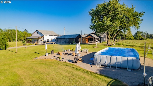 8408 NE 339th St, La Center, WA 98629 - view of swimming pool with a lawn and a covered pool
