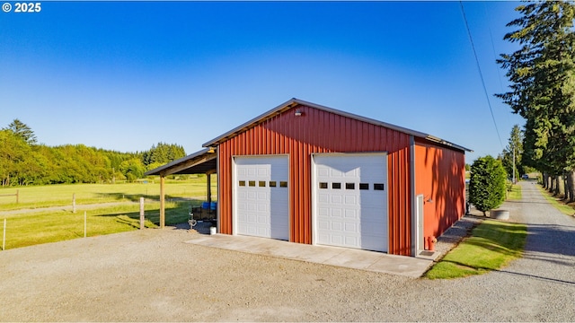 8408 NE 339th St, La Center, WA 98629 - garage featuring a detached garage and a view of trees