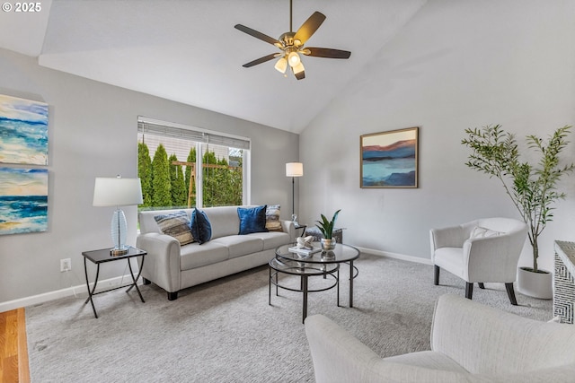 living area featuring carpet, a ceiling fan, baseboards, and high vaulted ceiling