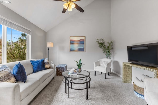 carpeted living area featuring high vaulted ceiling, baseboards, and ceiling fan