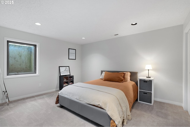 bedroom featuring baseboards, light carpet, recessed lighting, and visible vents
