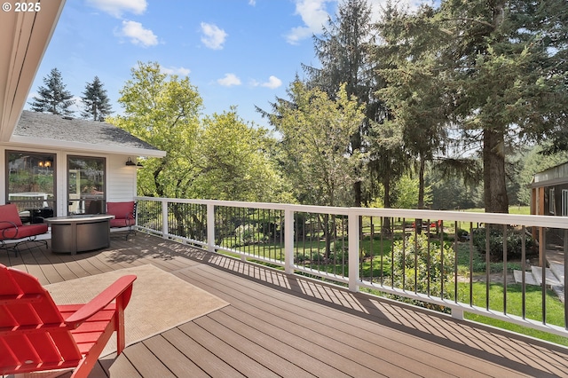 wooden deck with a fire pit