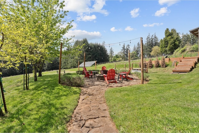 view of yard with an outdoor fire pit