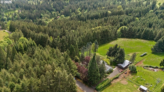 bird's eye view featuring a wooded view