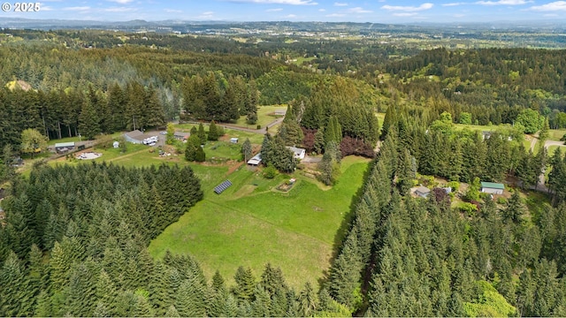 bird's eye view featuring a forest view
