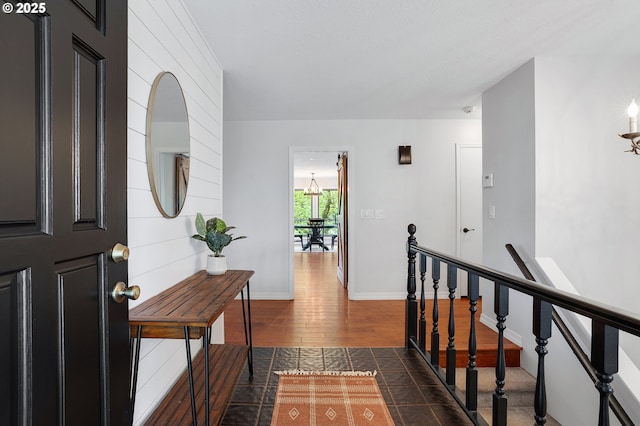 entrance foyer featuring baseboards and dark wood finished floors
