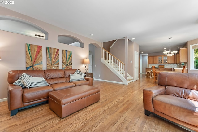 3140 Sabo Ln, West Linn, OR 97068 - living area with light wood-style floors, stairs, baseboards, arched walkways, and recessed lighting