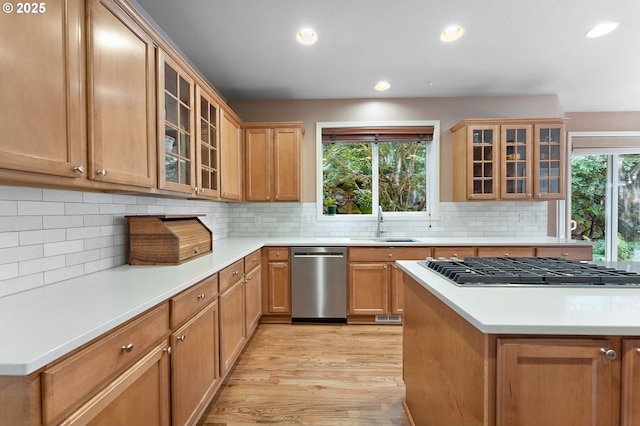 3140 Sabo Ln, West Linn, OR 97068 - kitchen with appliances with stainless steel finishes, light wood finished floors, a sink, light countertops, and recessed lighting