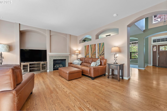 3140 Sabo Ln, West Linn, OR 97068 - living room with wood finished floors, a tile fireplace, and arched walkways
