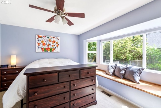 1425 SE 96th Ave, Vancouver, WA 98664 - bedroom featuring light carpet, multiple windows, baseboards, and a ceiling fan