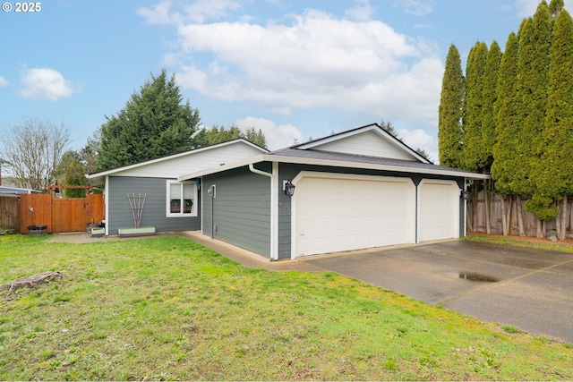 garage with fence and driveway