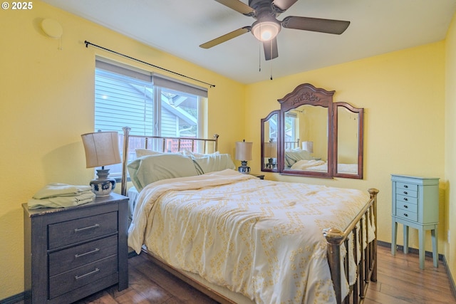 bedroom with dark wood-style flooring and ceiling fan