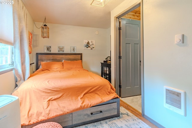 bedroom featuring light wood-style floors