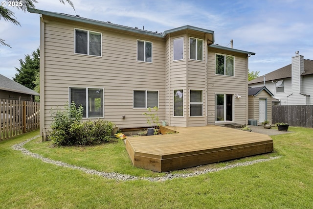 rear view of house featuring a deck