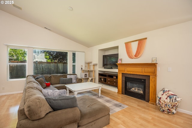 5419 Baden Way, Eugene, OR 97402 - living room featuring light wood-type flooring, a glass covered fireplace, and lofted ceiling