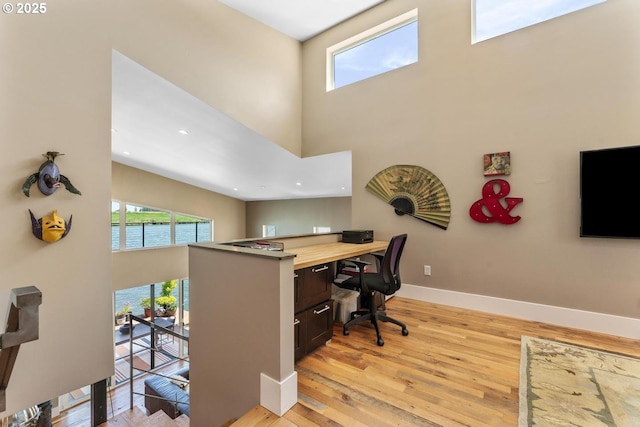 23586 NW St Helens Rd Unit U12, Portland, OR 97231 - office with a towering ceiling, light wood-type flooring, and baseboards