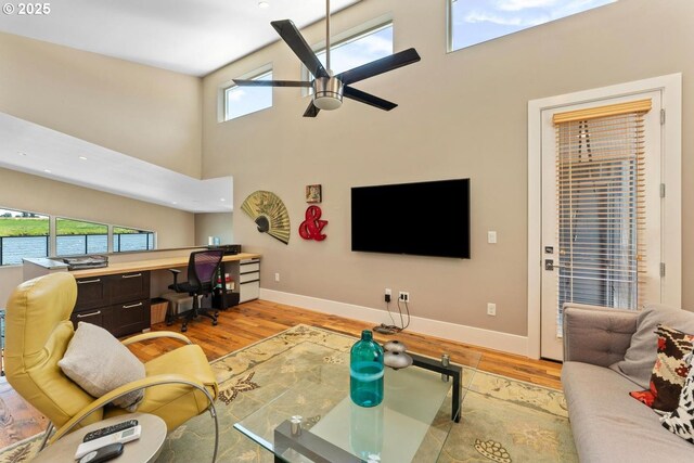 23586 NW St Helens Rd Unit U12, Portland, OR 97231 - living room with a ceiling fan, light wood-type flooring, healthy amount of natural light, and a high ceiling