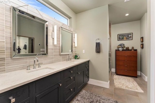 23586 NW St Helens Rd Unit U12, Portland, OR 97231 - bathroom with decorative backsplash, baseboards, double vanity, tile patterned flooring, and recessed lighting