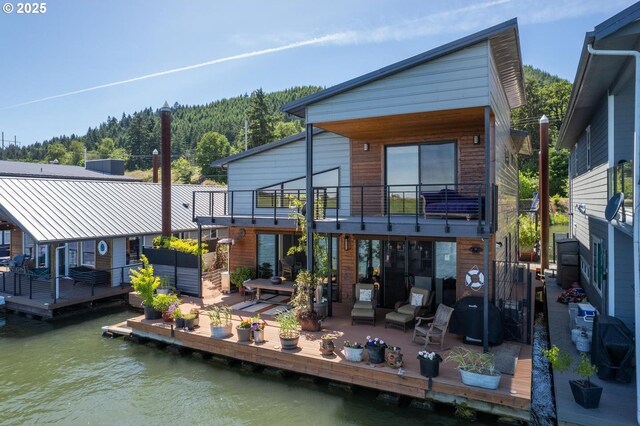 23586 NW St Helens Rd Unit U12, Portland, OR 97231 - rear view of house with a balcony and a water view