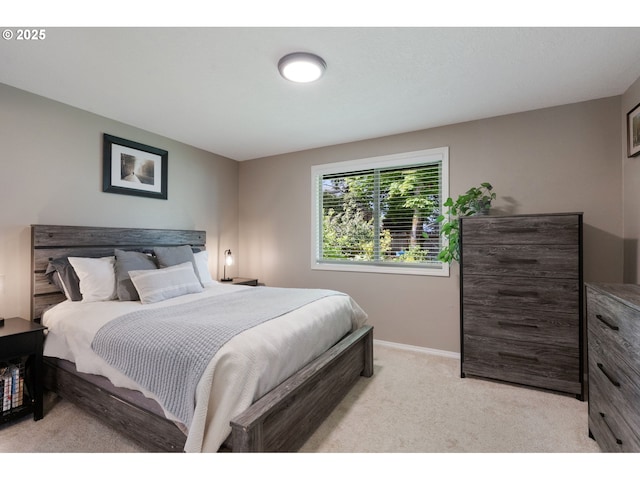 bedroom featuring carpet flooring and baseboards