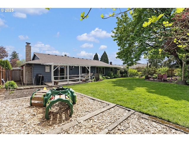 back of property featuring a patio, fence, and a chimney