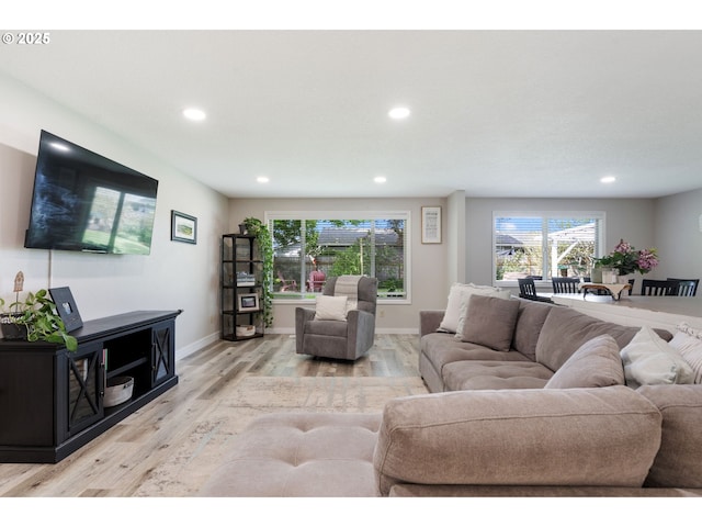 living area with recessed lighting, baseboards, and wood finished floors