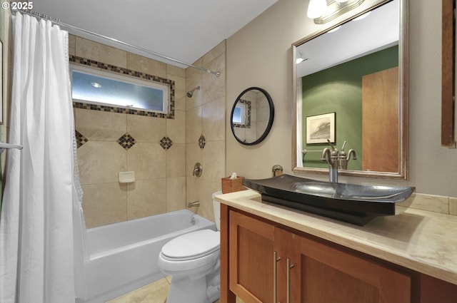 bathroom featuring toilet, shower / bath combo, and vanity