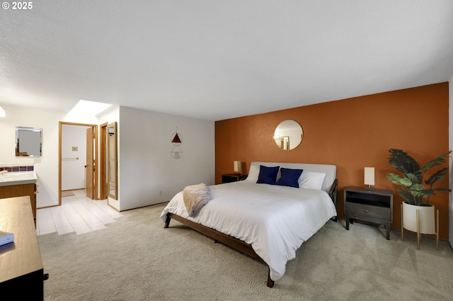 bedroom featuring light carpet