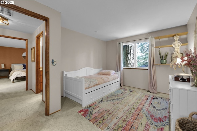 carpeted bedroom with visible vents