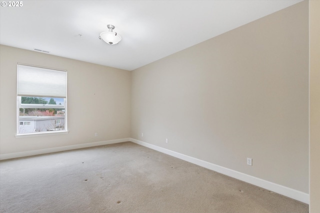 unfurnished room with carpet floors