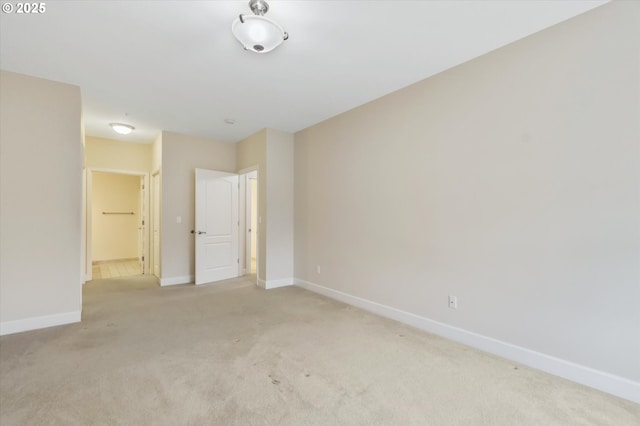 empty room featuring light carpet