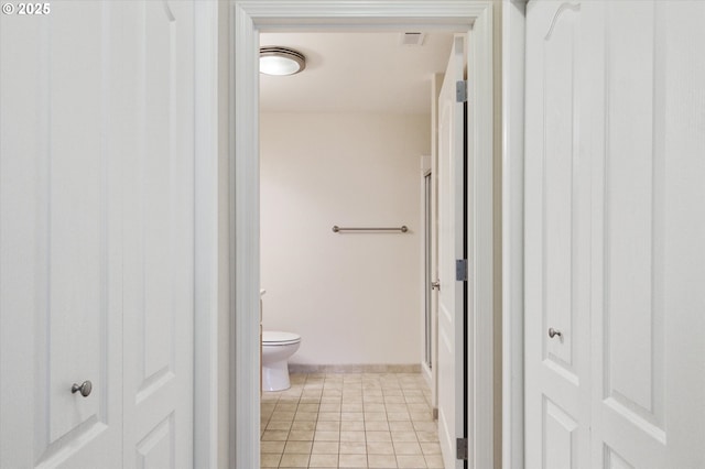 bathroom featuring tile patterned floors and toilet