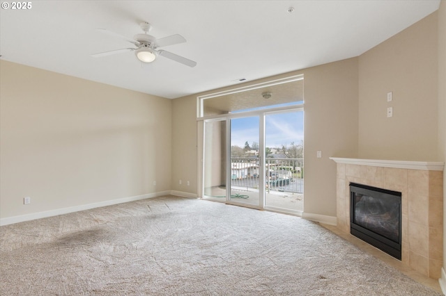 unfurnished living room featuring a fireplace, light colored carpet, and ceiling fan