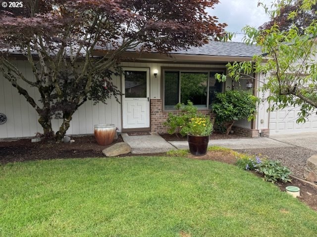 18622 SE Stephens Cir, Portland, OR 97233 - view of front of property with a front yard, a shingled roof, driveway, and an attached garage
