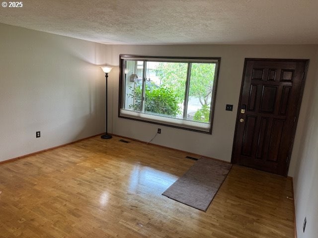 18622 SE Stephens Cir, Portland, OR 97233 - foyer with wood finished floors and a textured ceiling