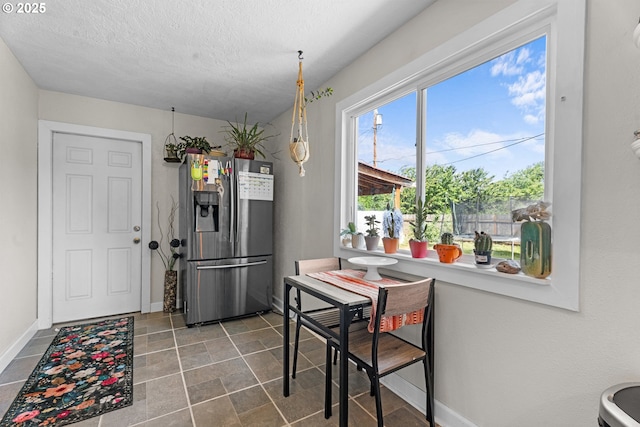 8015 NE 90th Ave, Vancouver, WA 98662 - dining space with baseboards and a textured ceiling