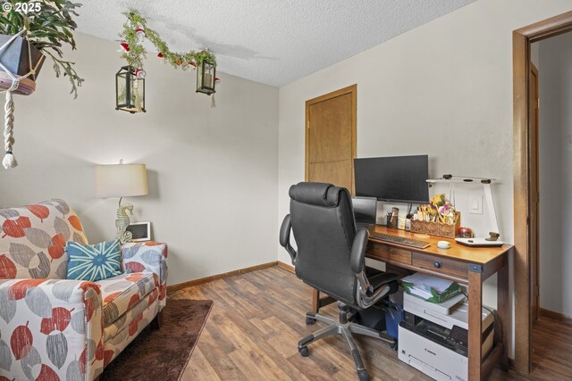 8015 NE 90th Ave, Vancouver, WA 98662 - home office with a textured ceiling, wood finished floors, and baseboards