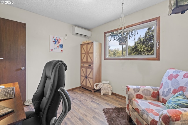 8015 NE 90th Ave, Vancouver, WA 98662 - office space featuring a wall unit AC, wood finished floors, a textured ceiling, and baseboards