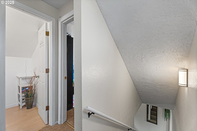 8015 NE 90th Ave, Vancouver, WA 98662 - staircase with wood finished floors, a textured ceiling, and baseboards