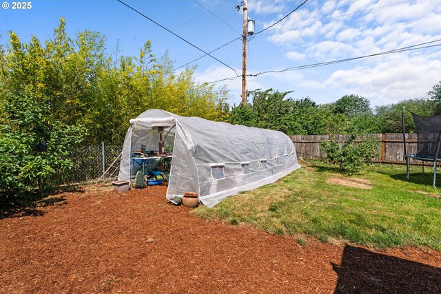 8015 NE 90th Ave, Vancouver, WA 98662 - view of yard with a trampoline, an exterior structure, and an outbuilding