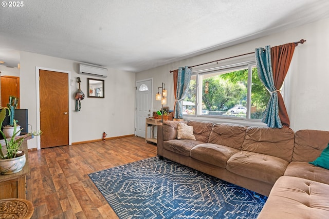 8015 NE 90th Ave, Vancouver, WA 98662 - living area with a wall mounted AC, wood finished floors, baseboards, and a textured ceiling
