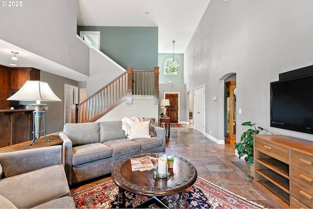 380 Mountaingate Dr, Springfield, OR 97478 - living area featuring a towering ceiling, stairway, and stone finish flooring
