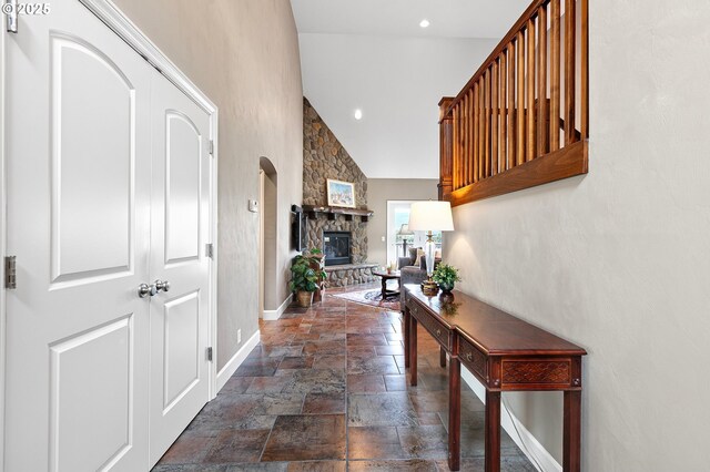 380 Mountaingate Dr, Springfield, OR 97478 - entrance foyer featuring stone tile floors, high vaulted ceiling, a stone fireplace, and recessed lighting