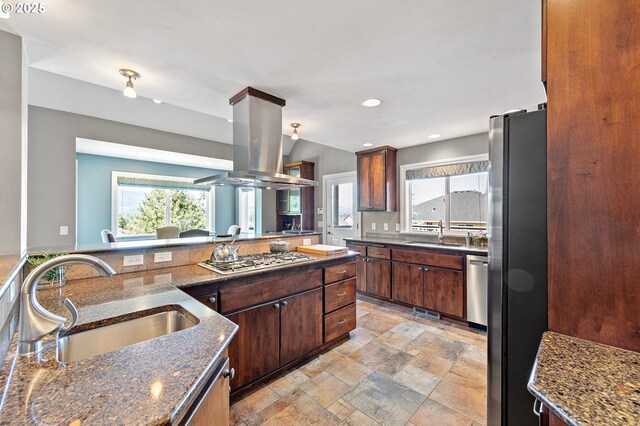 380 Mountaingate Dr, Springfield, OR 97478 - kitchen with stainless steel appliances, island range hood, light stone finish floors, dark stone countertops, and recessed lighting
