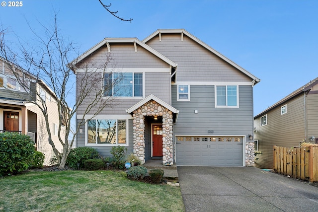 view of front of property featuring a garage and a front yard